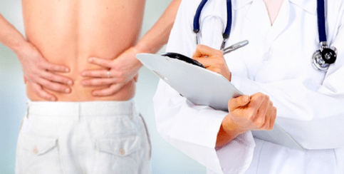 Doctor prescribes treatment for back pain