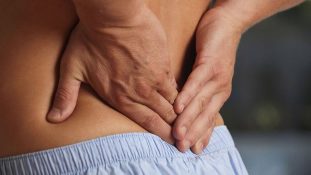 Discomfort in the lower back with osteonecrosis in the lower back